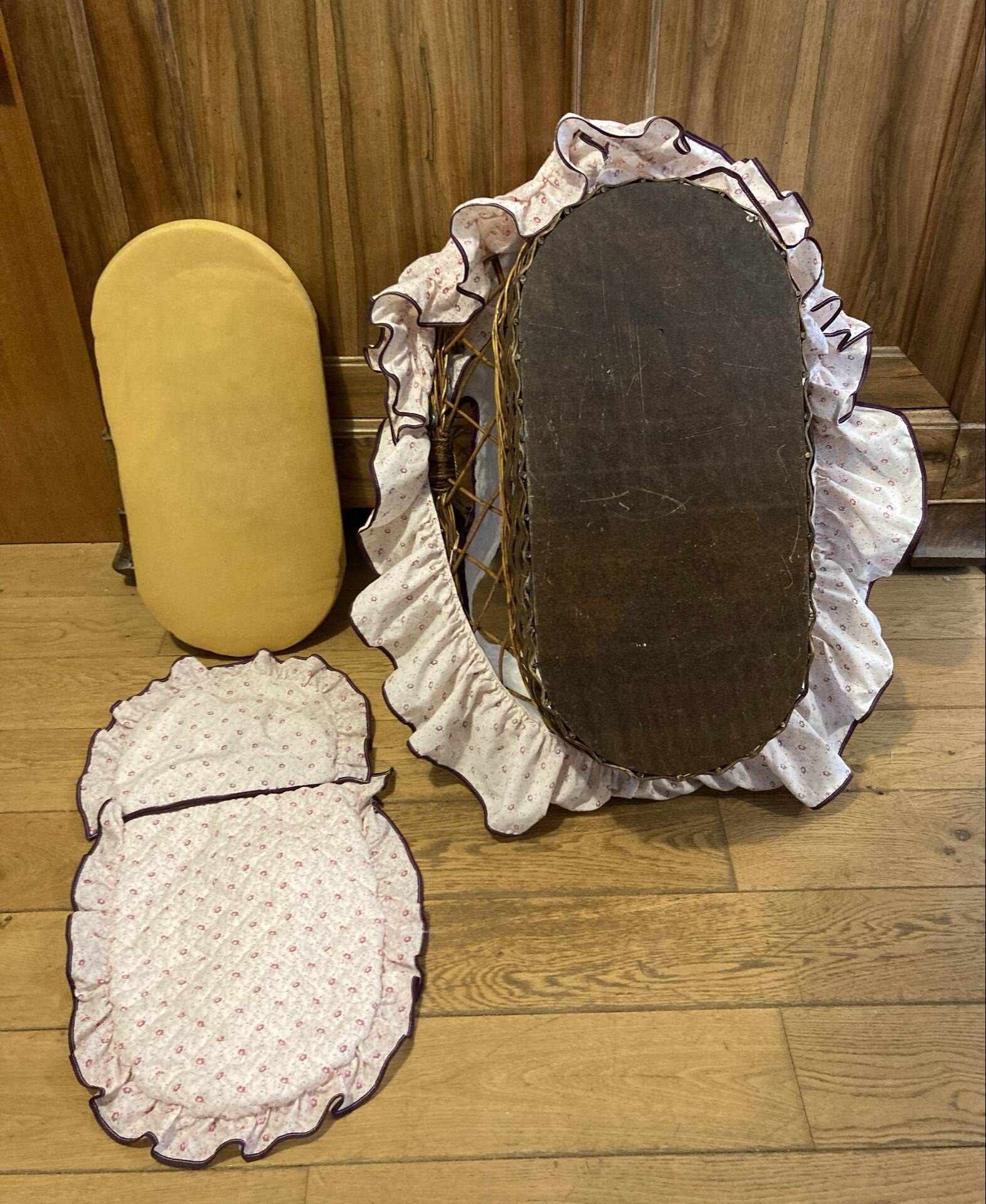 1960s wicker cradle with mattress and drapes.