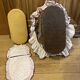 1960s wicker cradle with mattress and drapes.