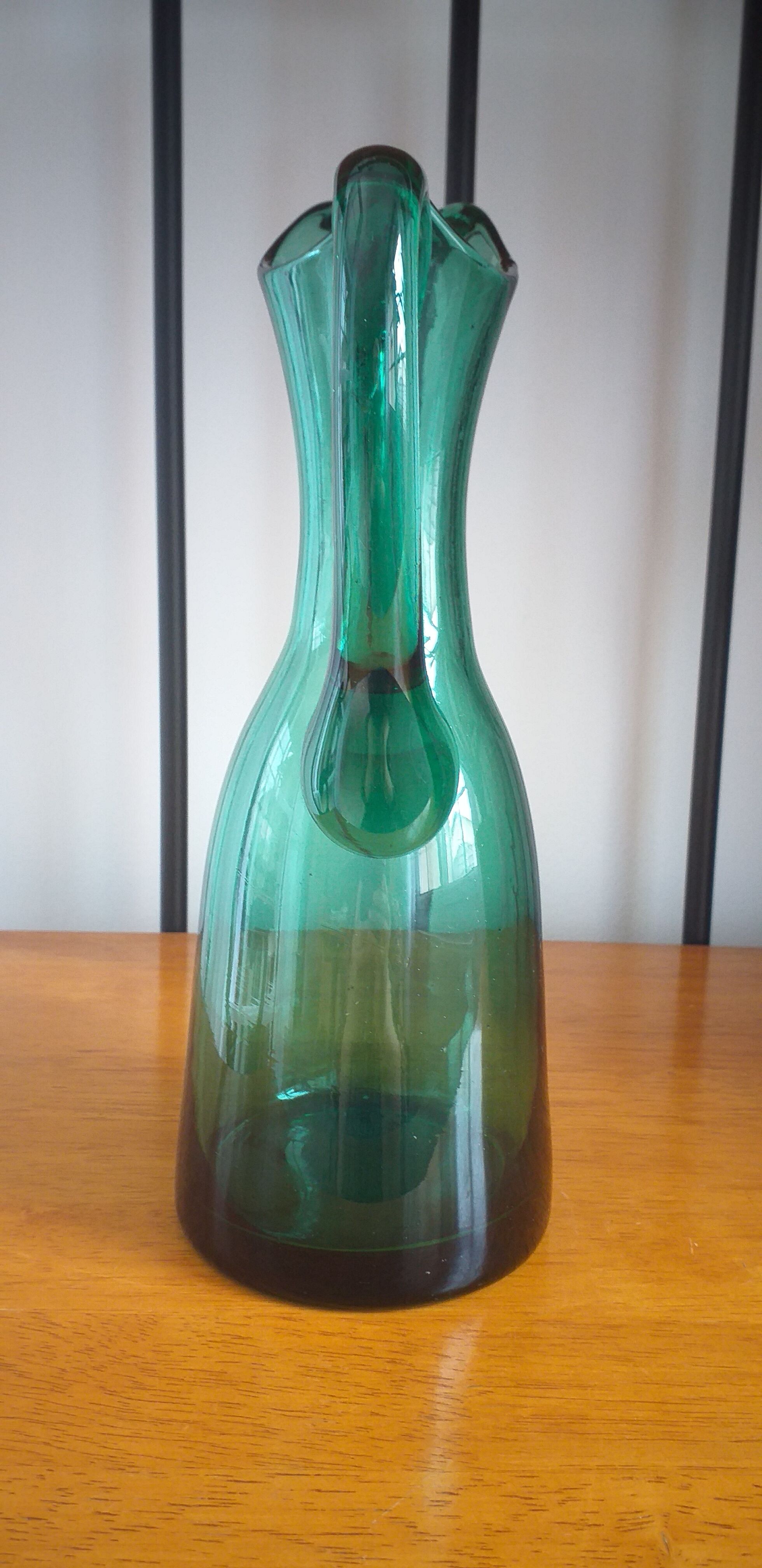 Pitcher made of green glass blown and tinted in the mass