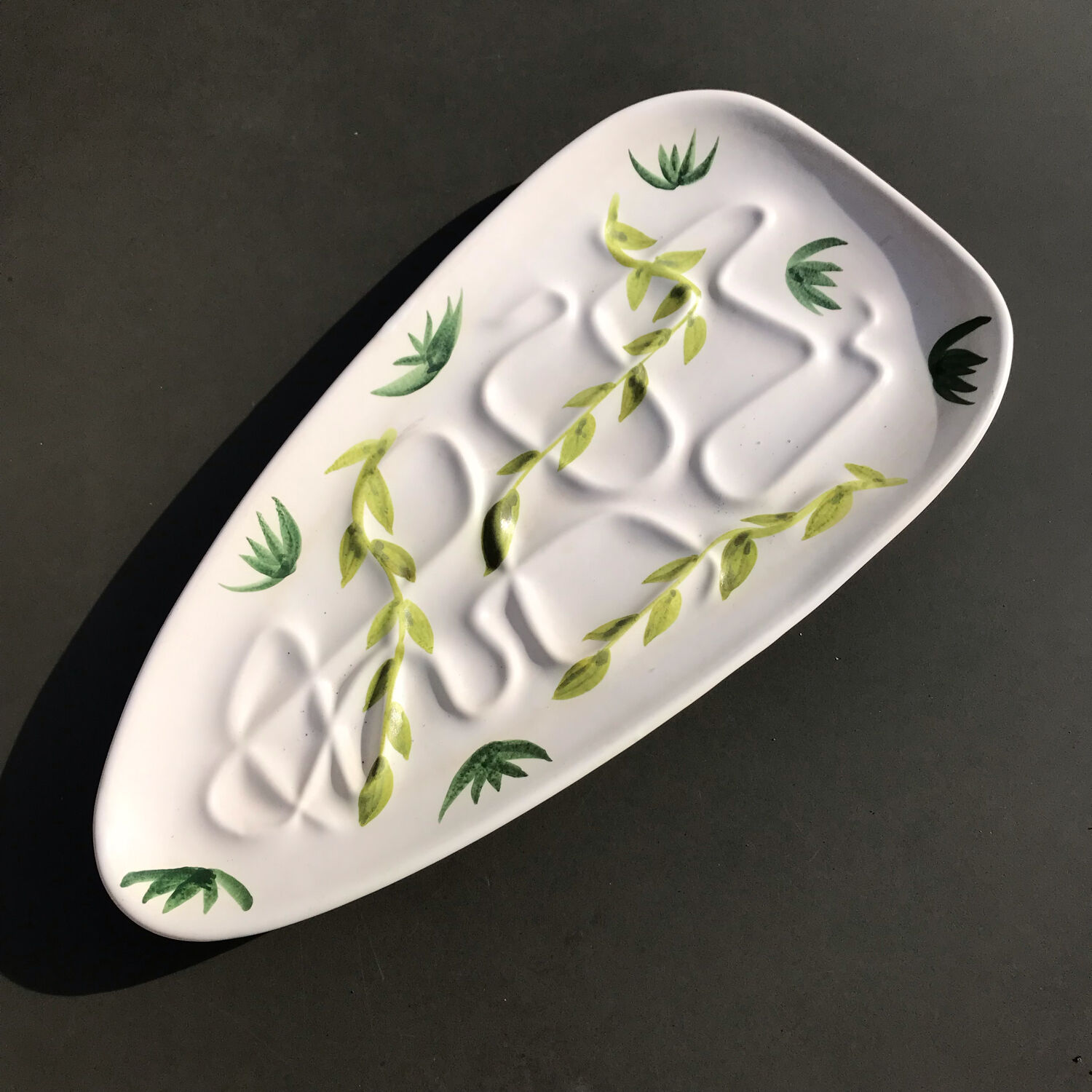Vintage dish stylized leaf patterns