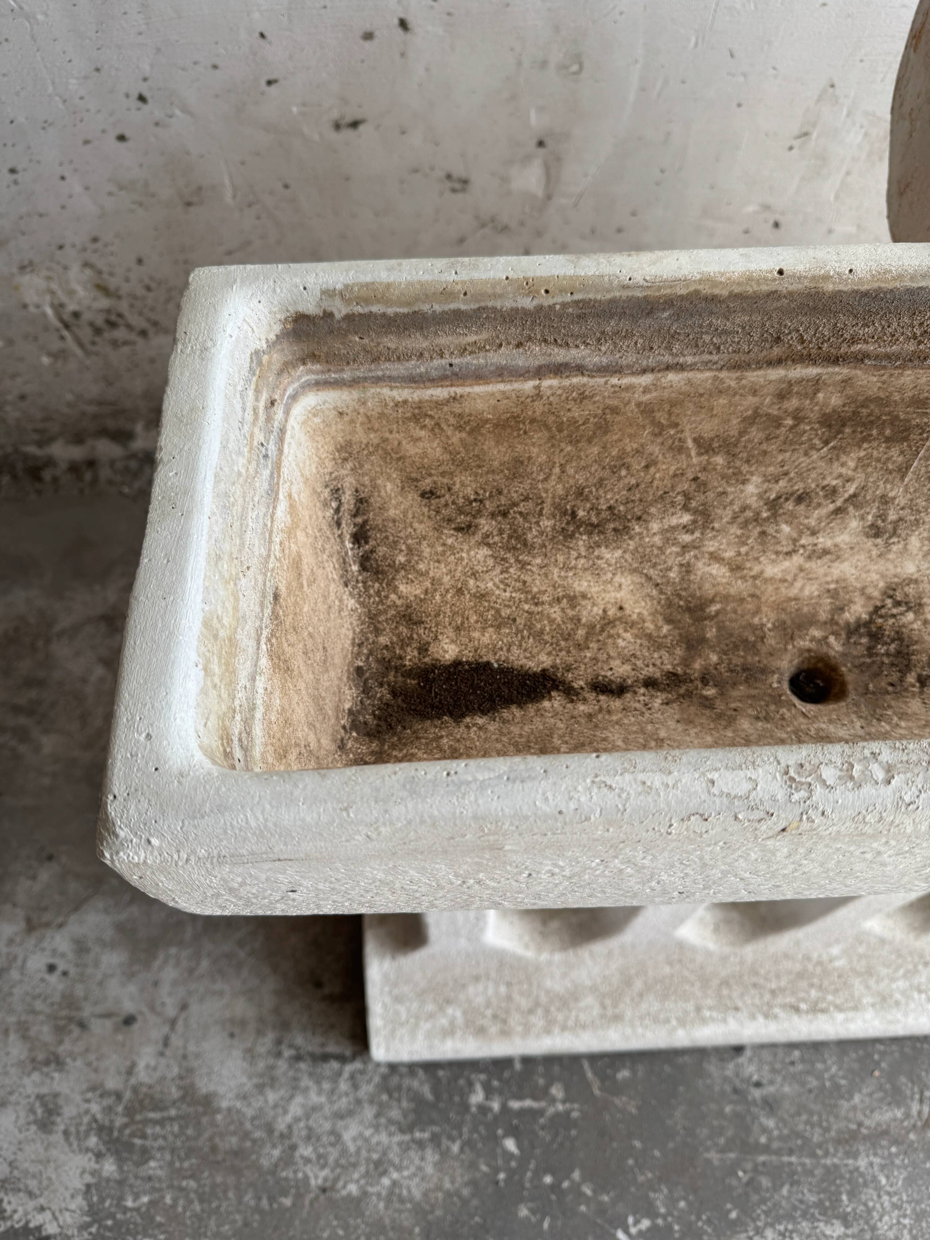 Pair of sculptural cast concrete planters in Off-White, mid-century brutalist style, long and rectangular.