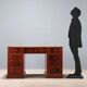 Antique mahogany desk with leather and bronze writing pad, 20th century.