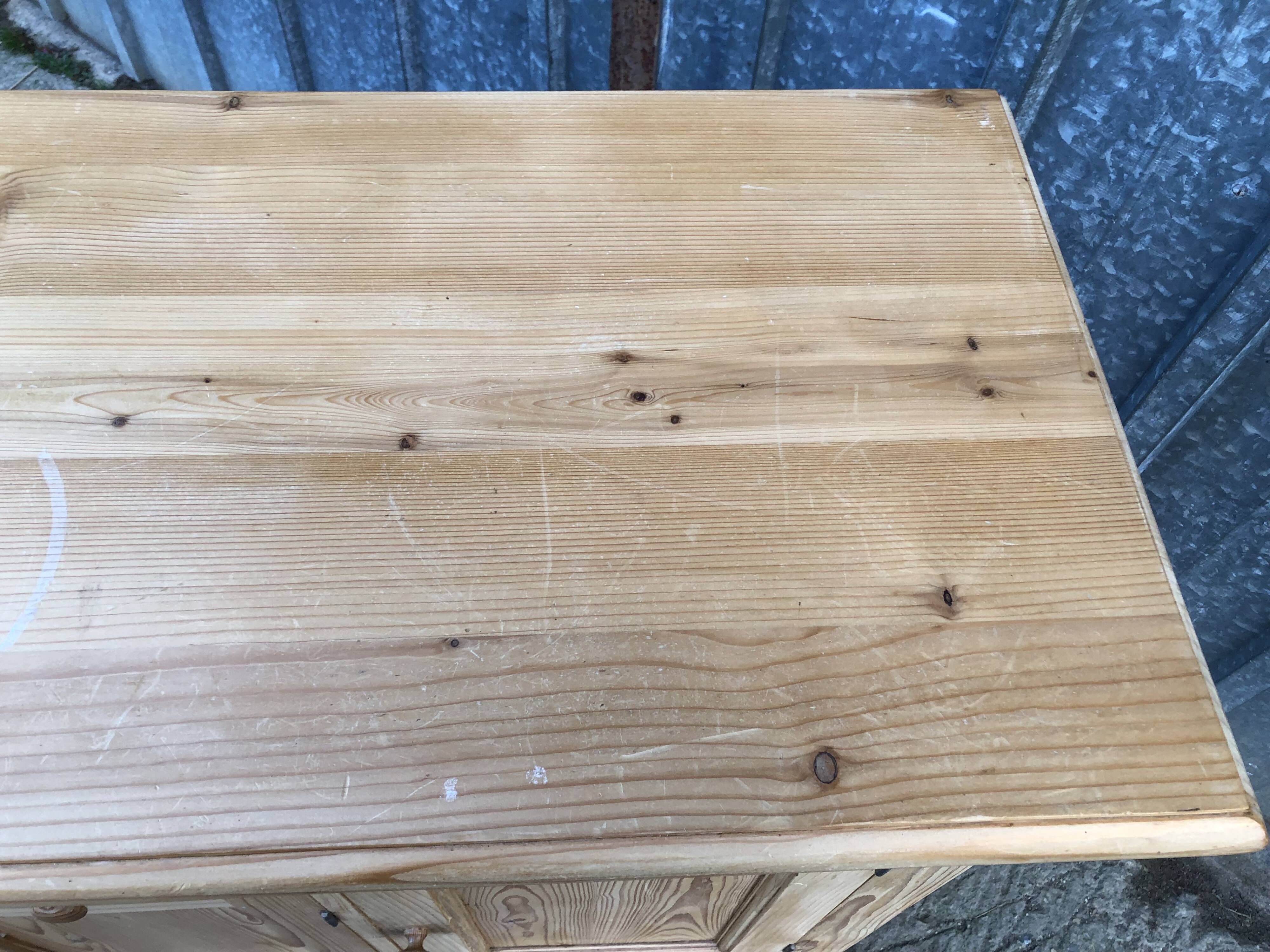 Scandinavian natural pine sideboard with 4 doors and 6 drawers.
