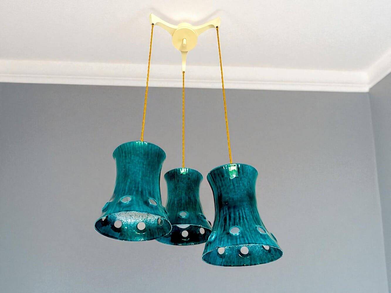 Green cast iron cascading chandelier