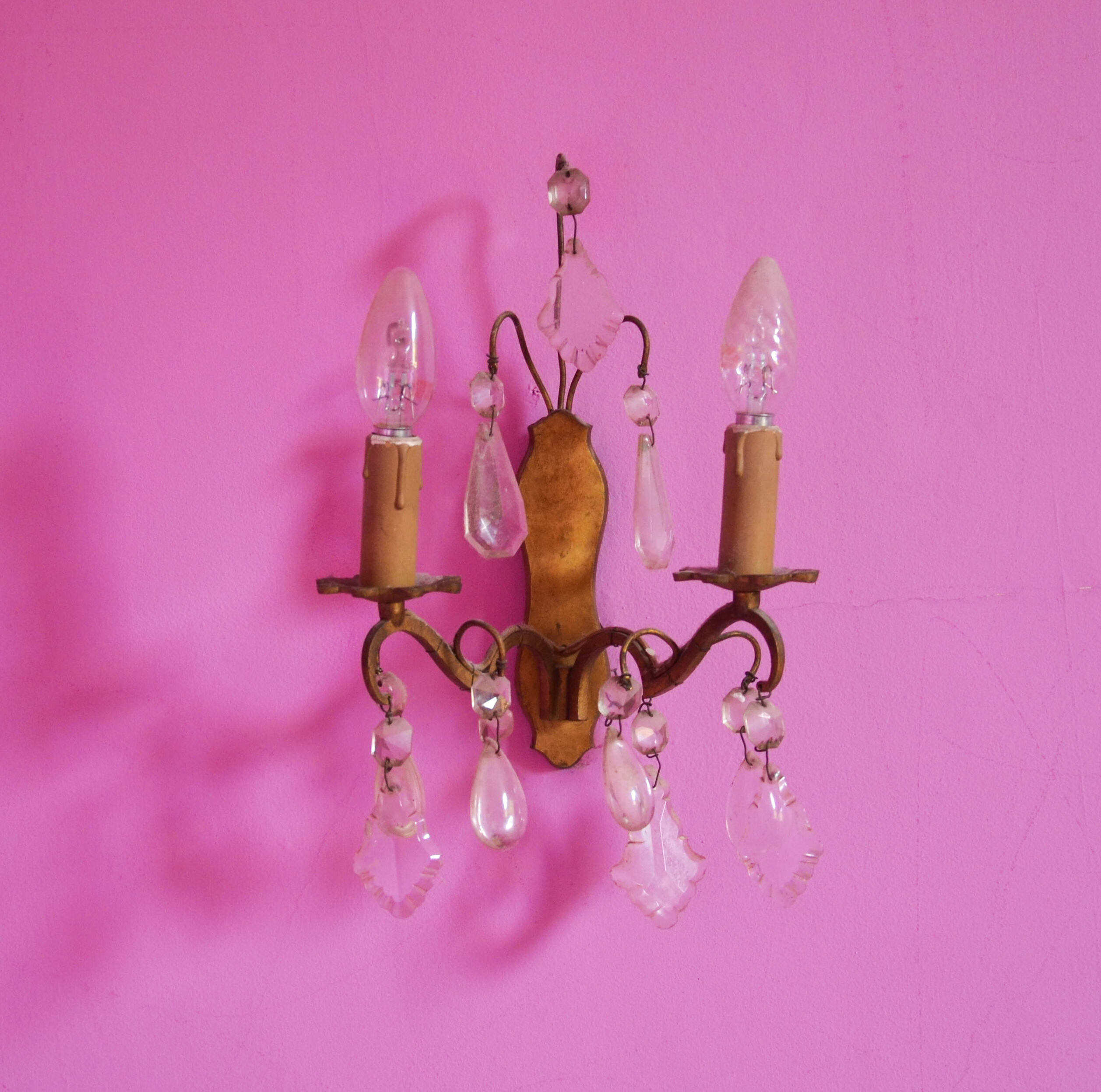 Pair of golden sconces with tassels