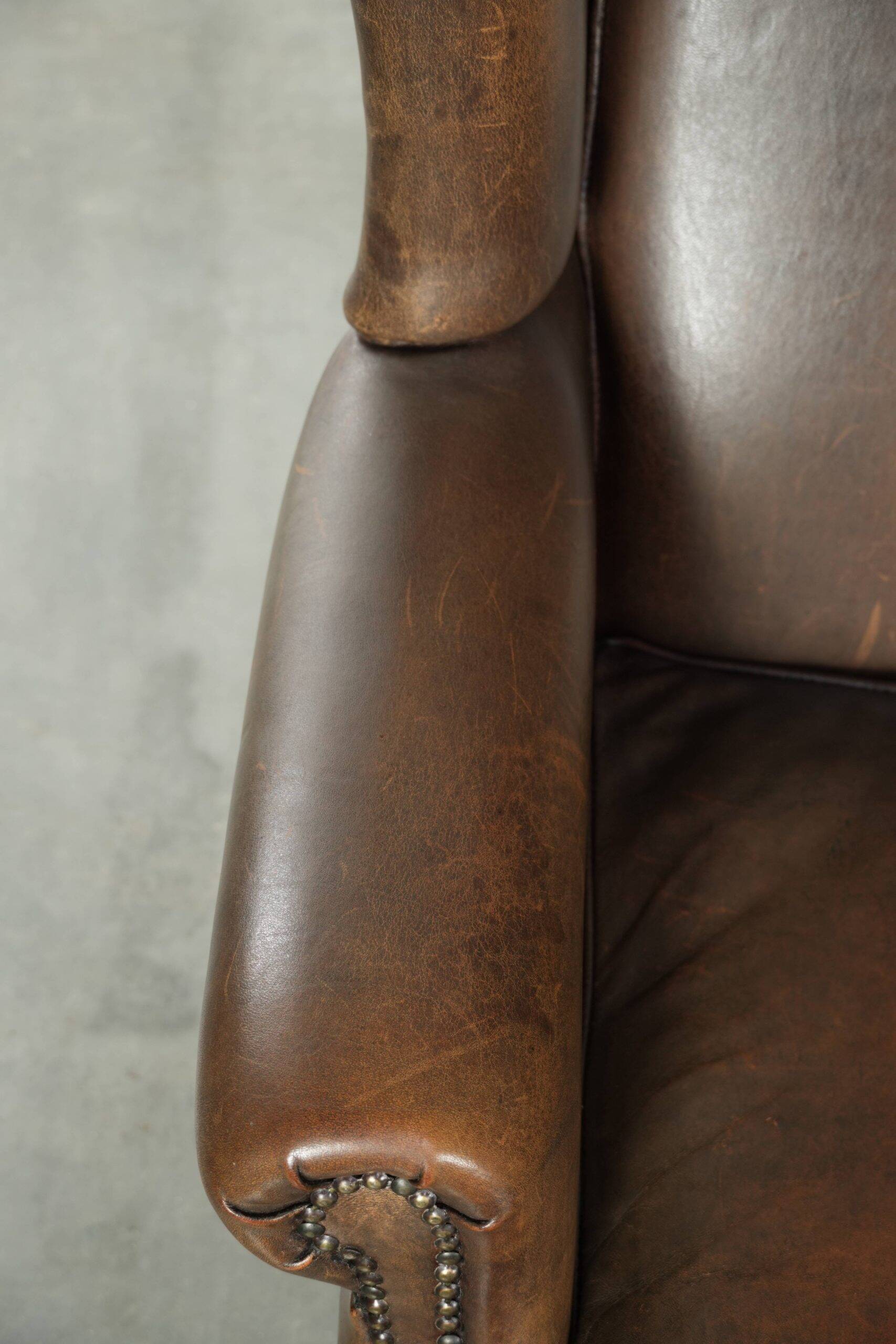 Large sheepskin wingback armchair with beautiful warm colours