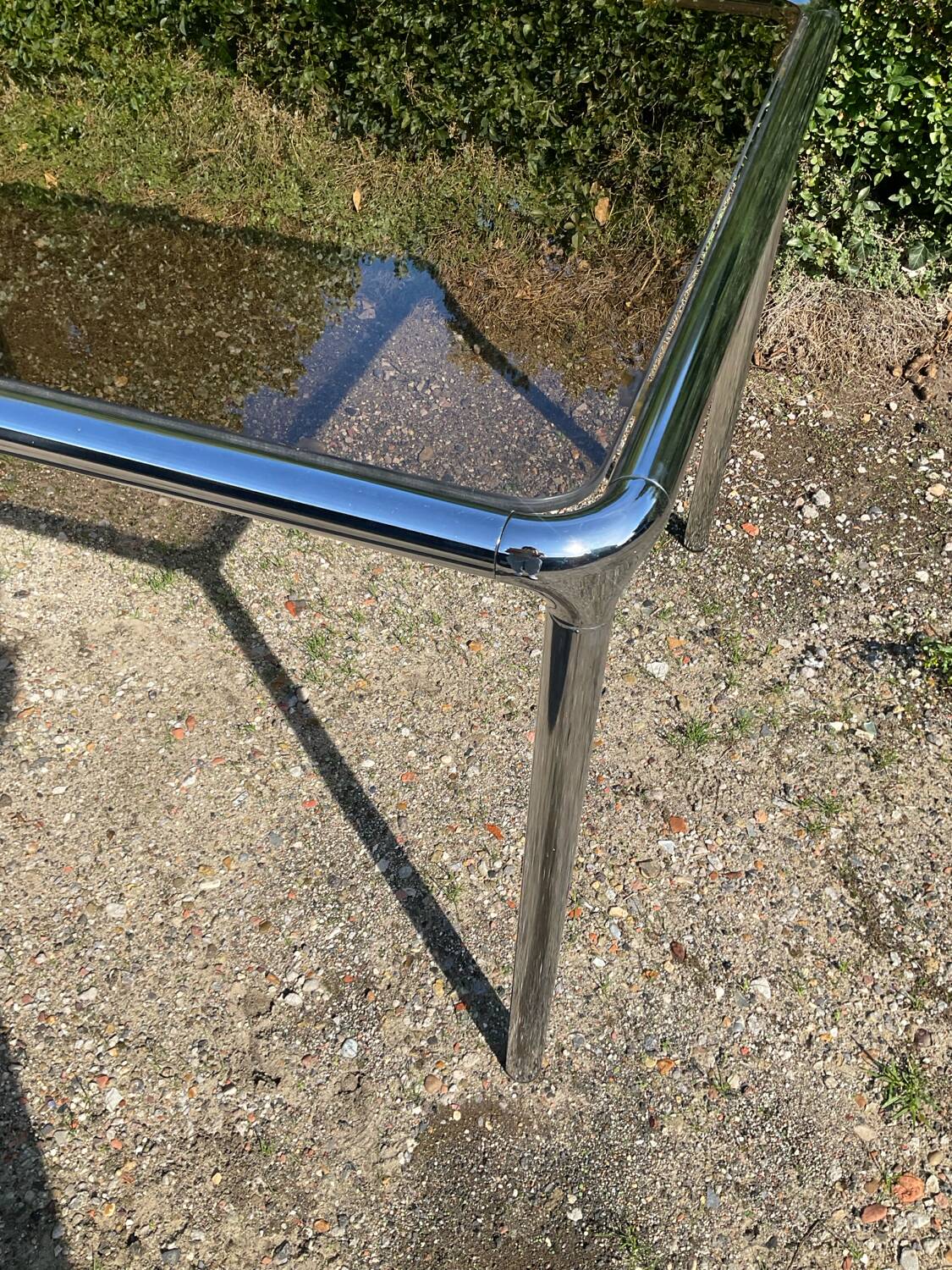 70s dining table in tubular chrome metal and smoked glass