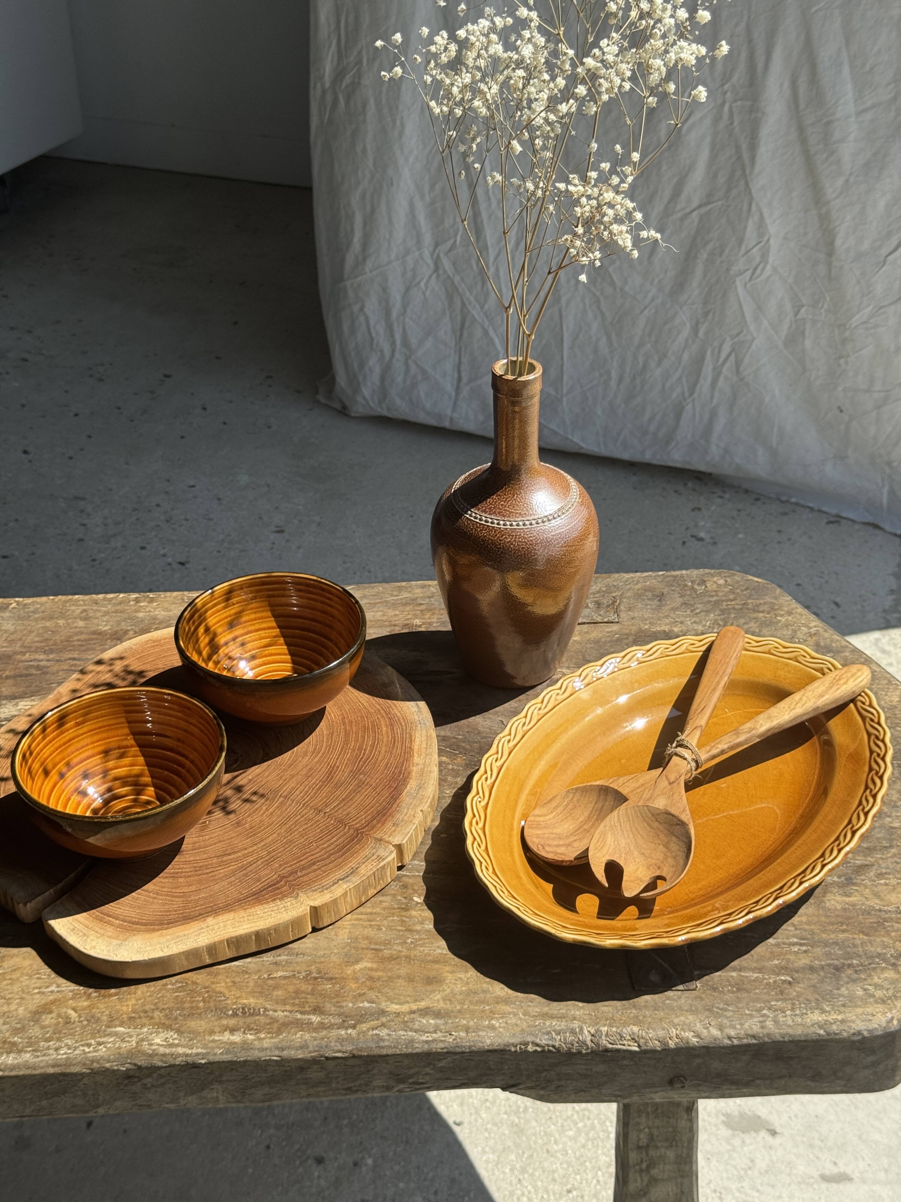 Pair of small orange bowls with black edging