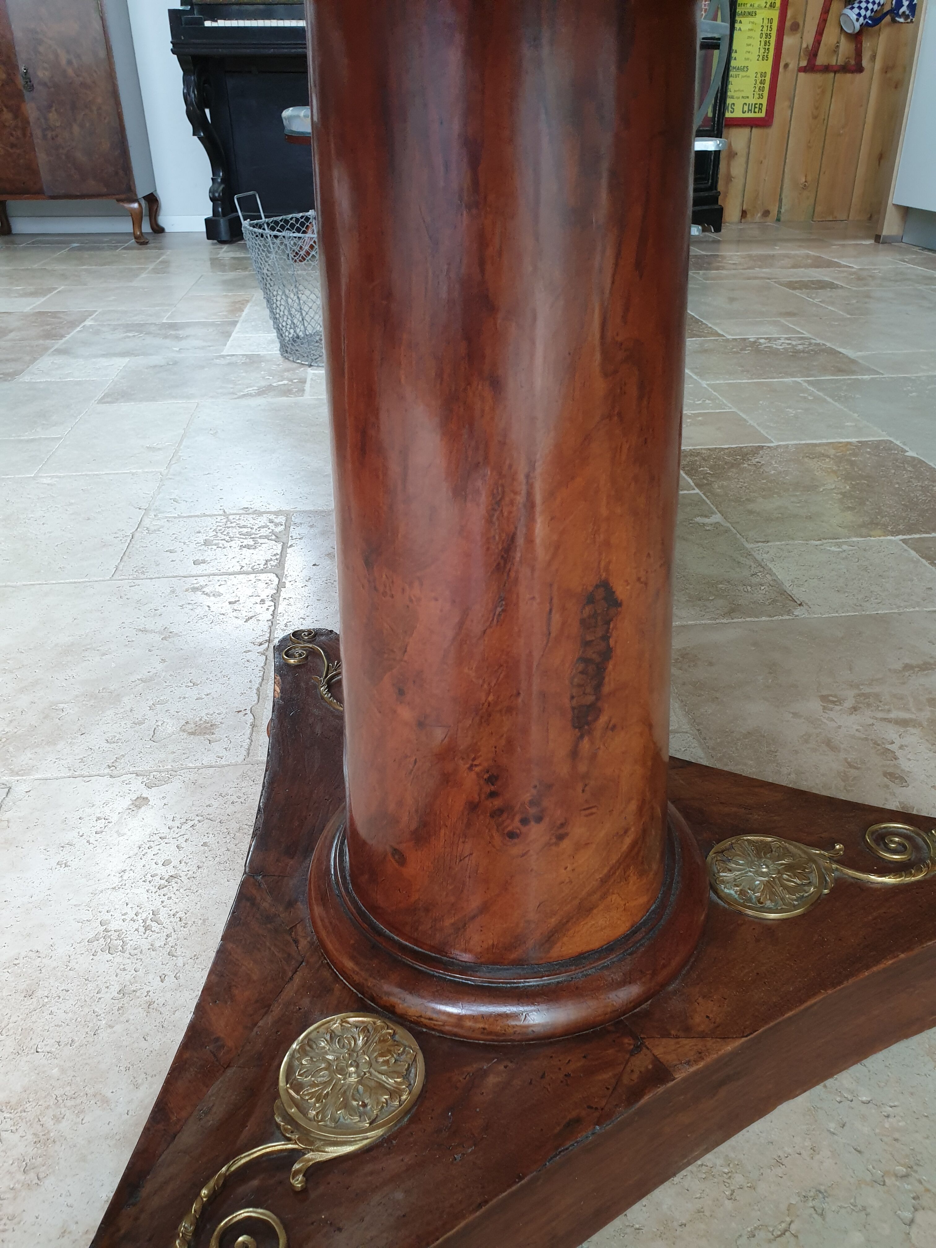 Pedestal table above marble