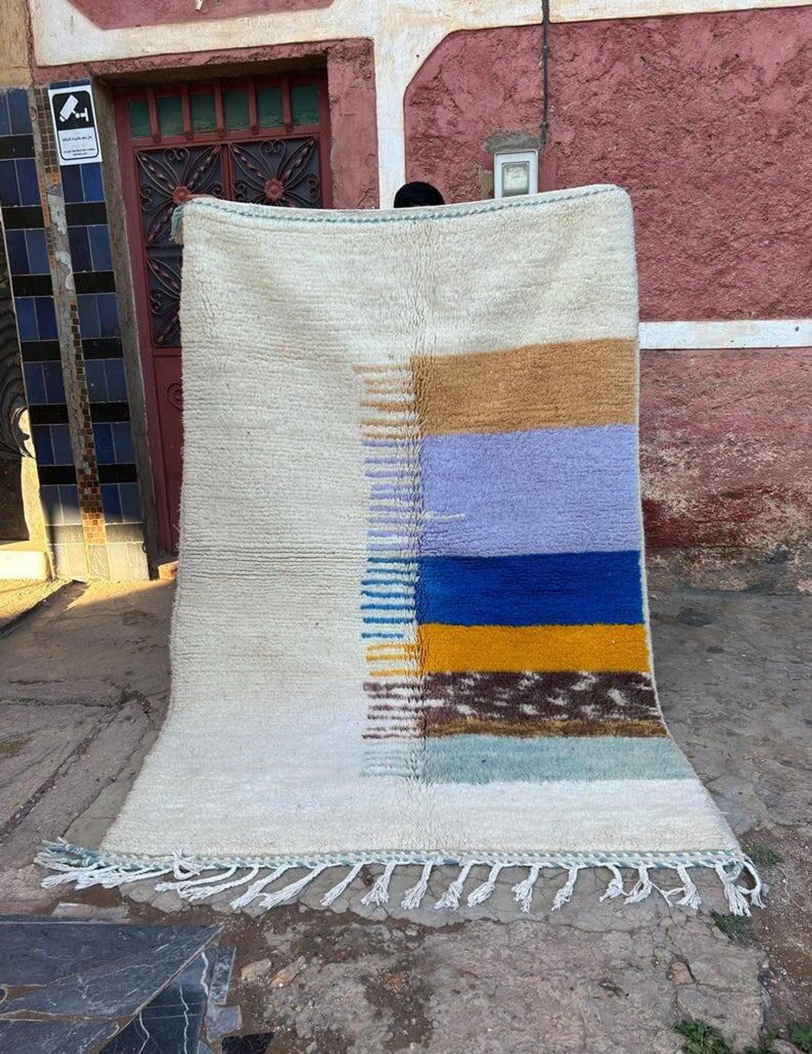 Handmade traditional pure wool rug with colourful patterns.