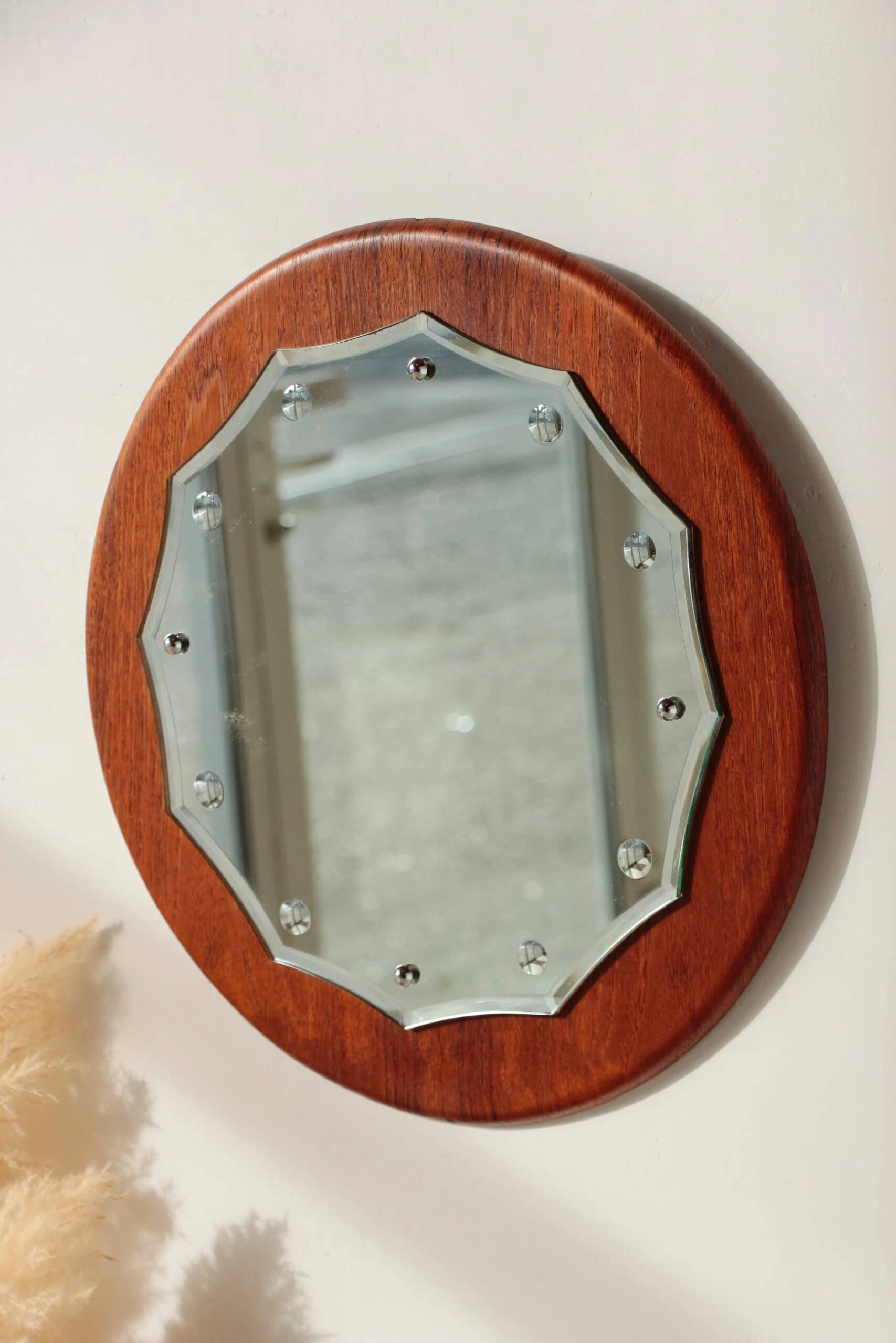 Vintage round teak mirror from the 1960s.