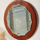 Vintage round teak mirror from the 1960s.