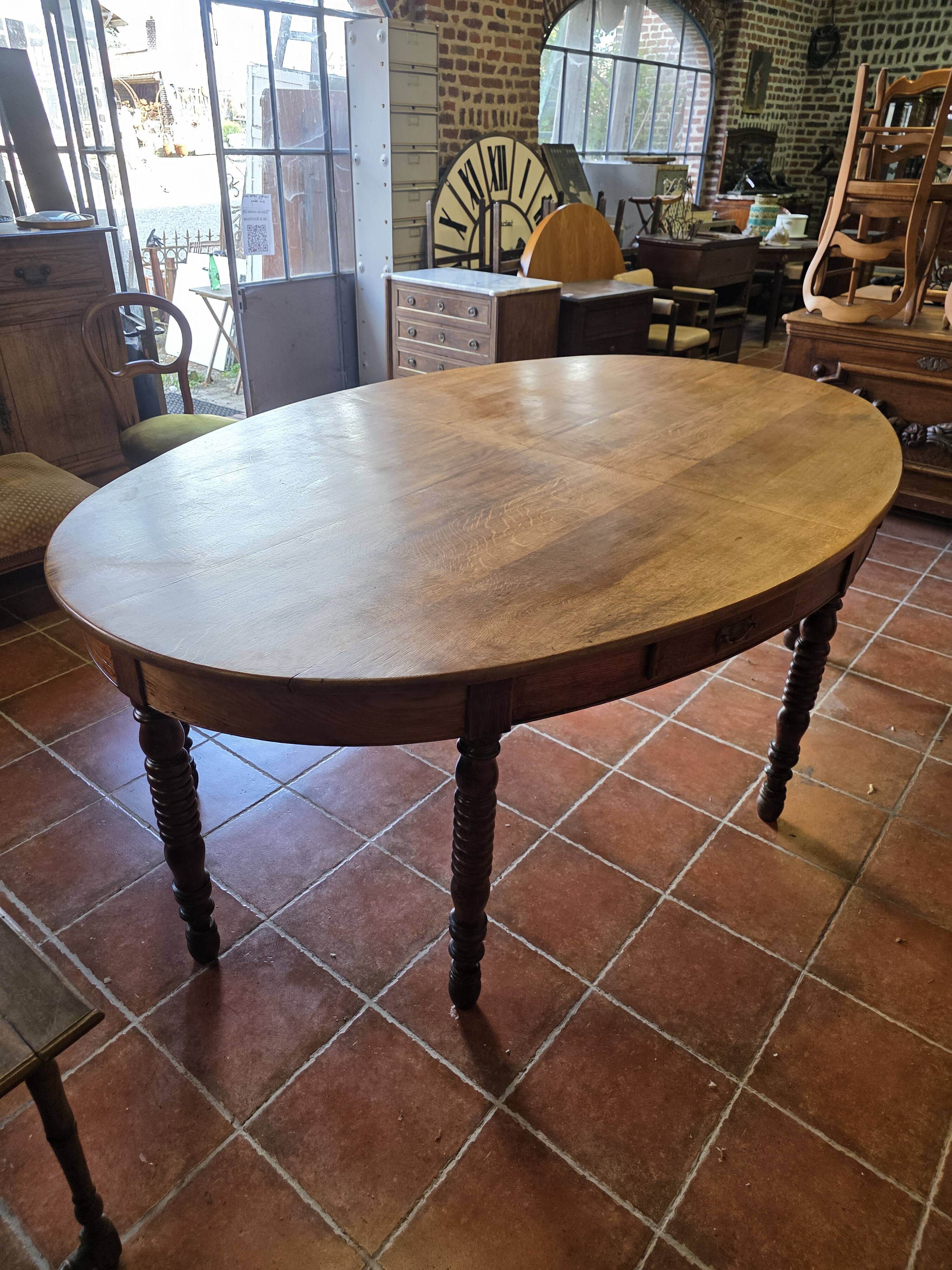 Large oval farmhouse table in solid oak, 19th century, 243 × 153cm