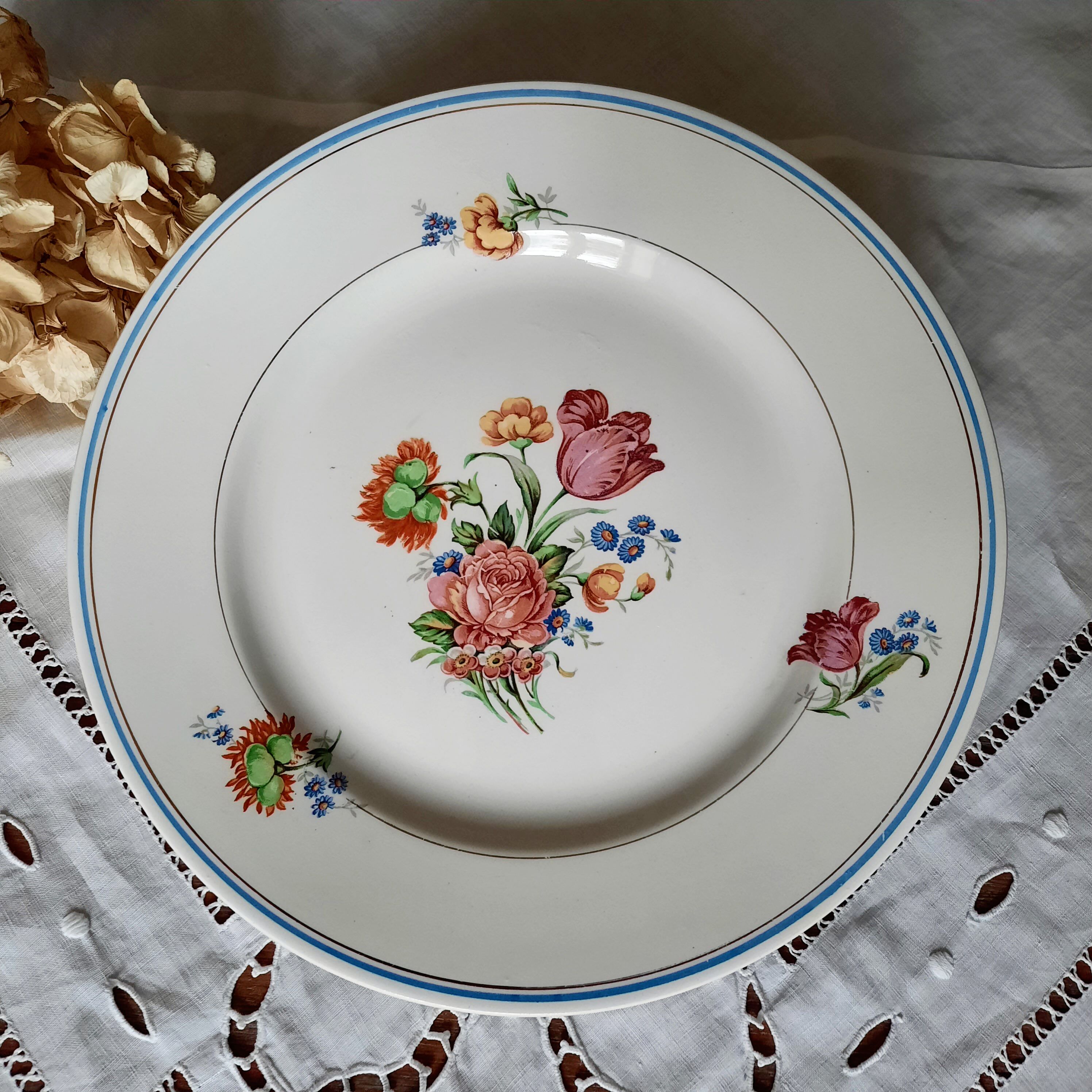 Pitted old flat earthenware plates with gold