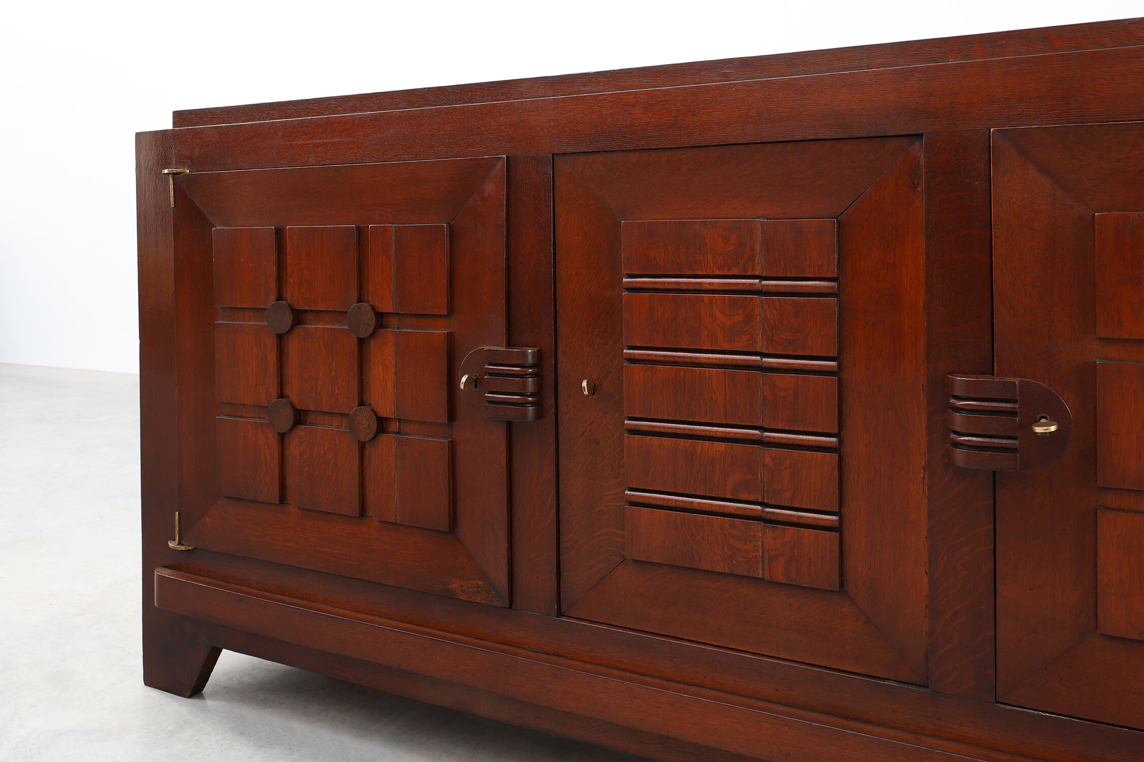 Art Deco carved geometric sideboard by Charles Dudouyt in oak, France ca. 1