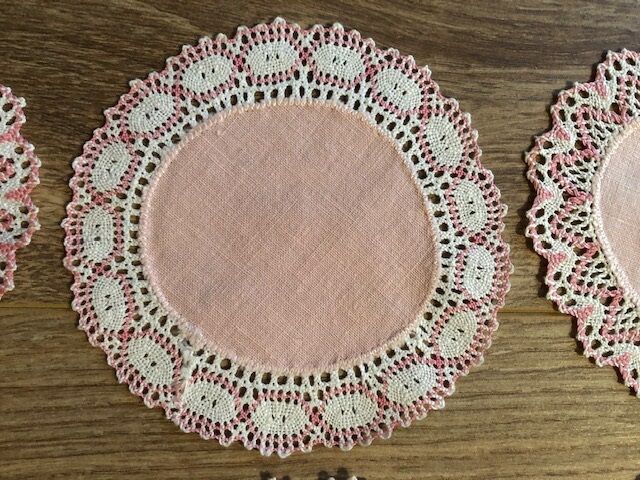 11 pink hand-lace coasters