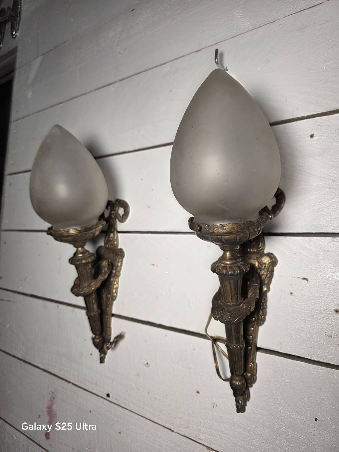 Pair of torch wall lights in Louis XVI style in 19th-century bronze.