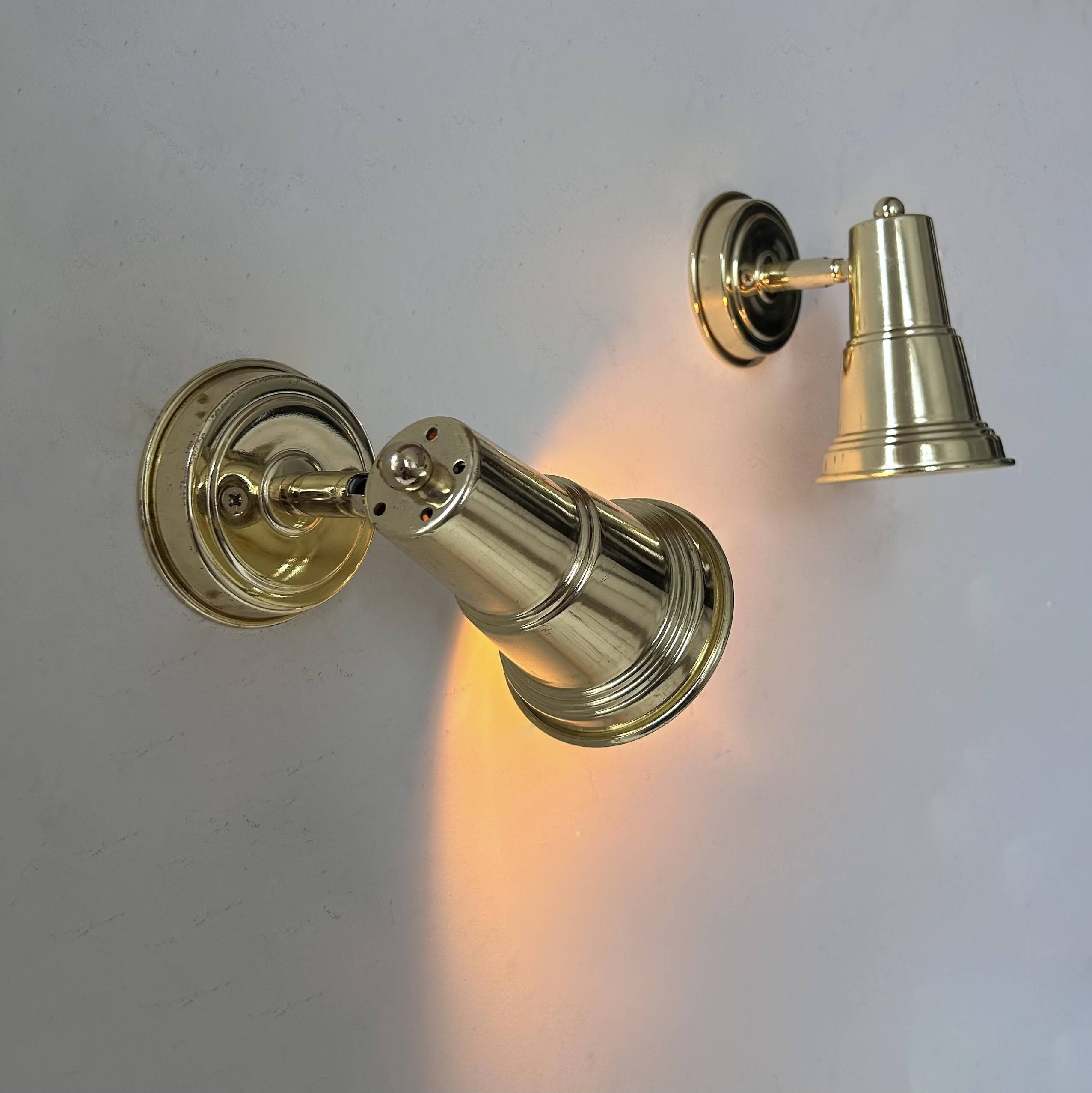Pair of vintage adjustable wall lights in solid brass, France 1970s