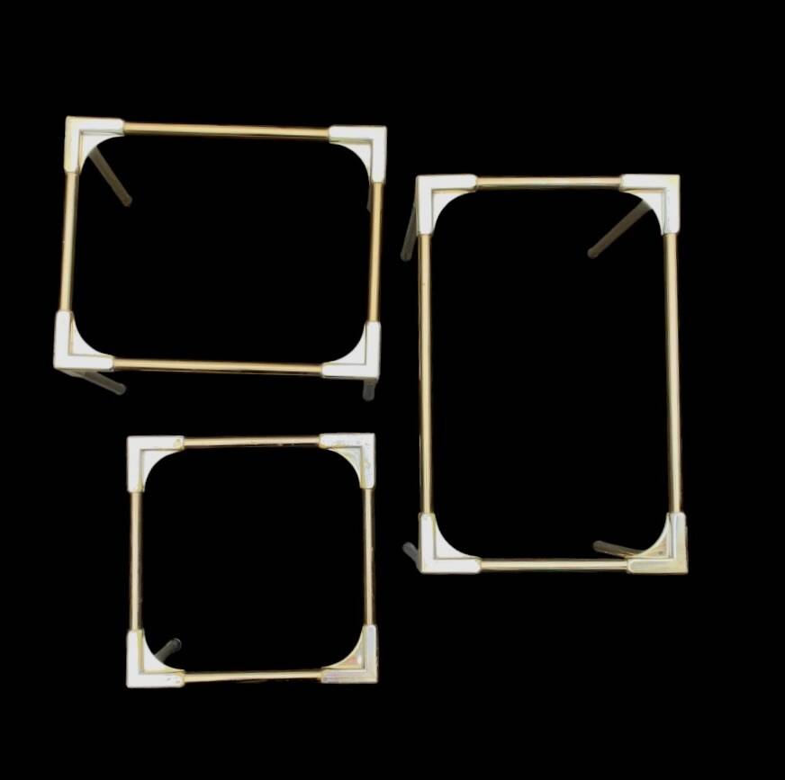 Trio of nesting tables in gold, smoked safety glass, 1970s