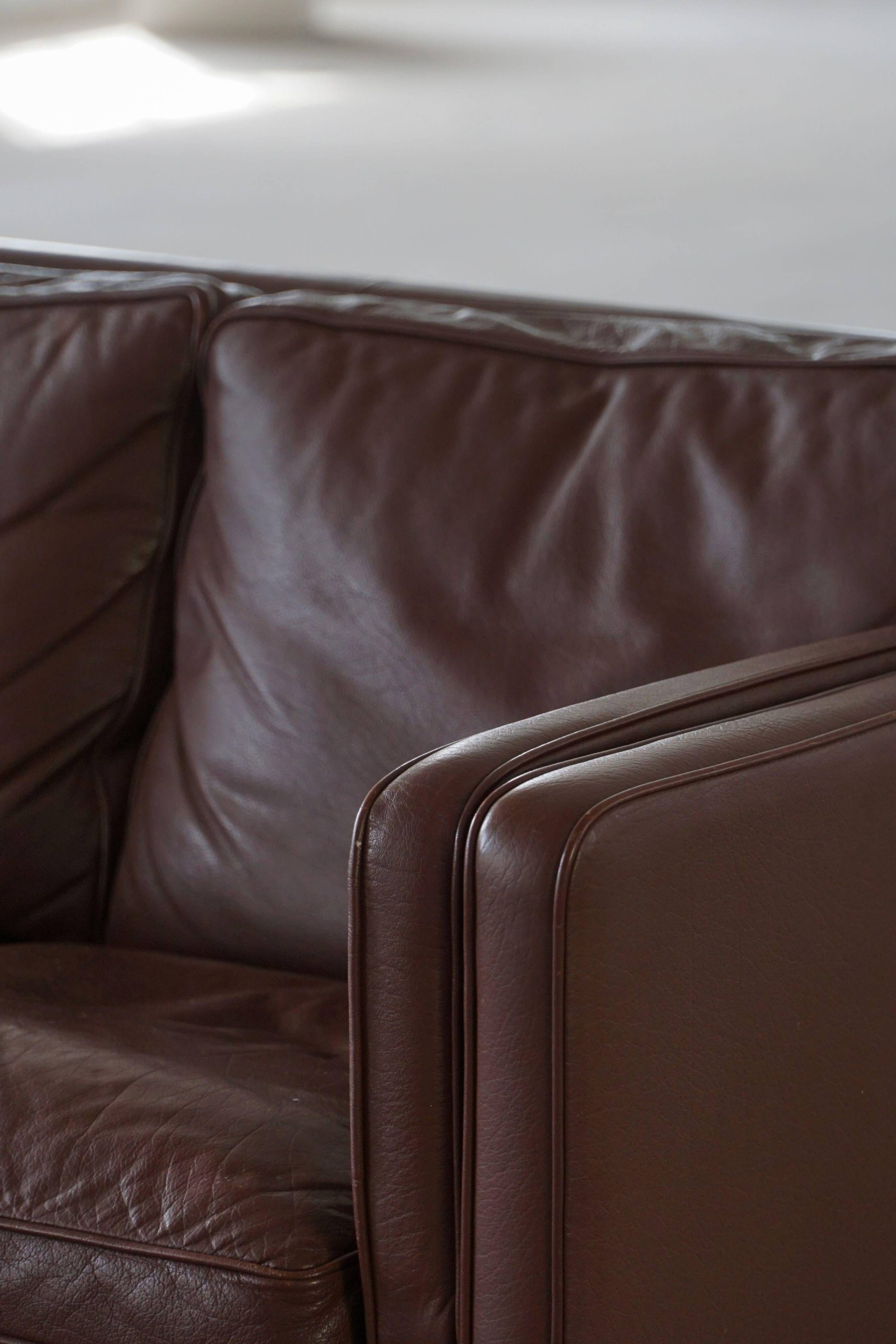 Stouby Møbelfabrik, two-seater sofa in mid-century style in brown leather, 1970s.