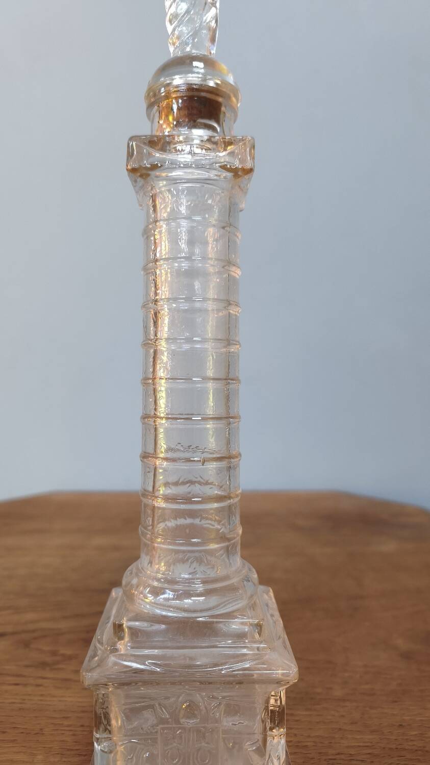 Vendôme column perfume bottle in moulded glass, 19th century.