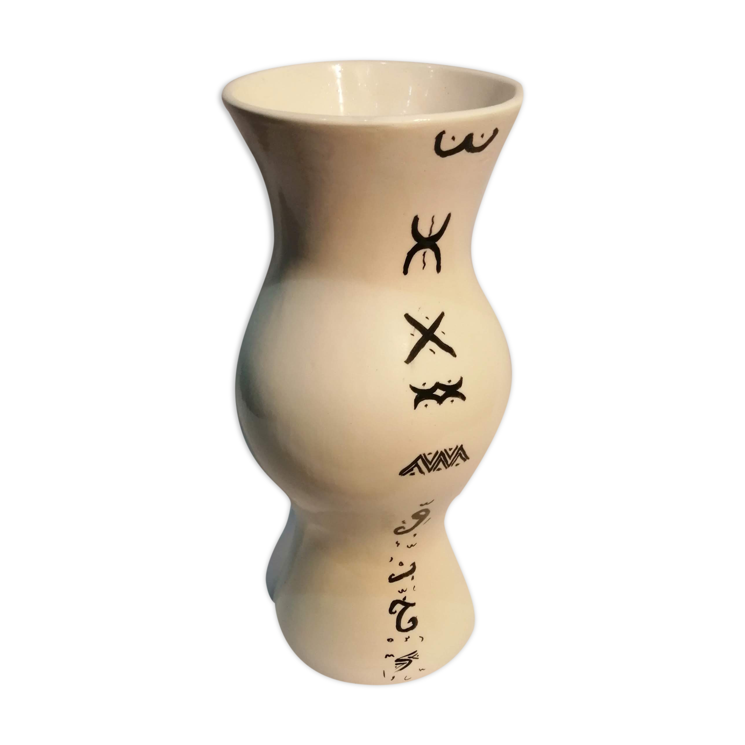Vase is decorated in white clay;han mad