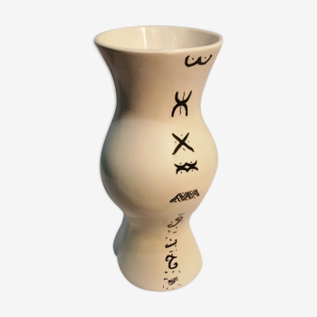 Vase is decorated in white clay;han mad
