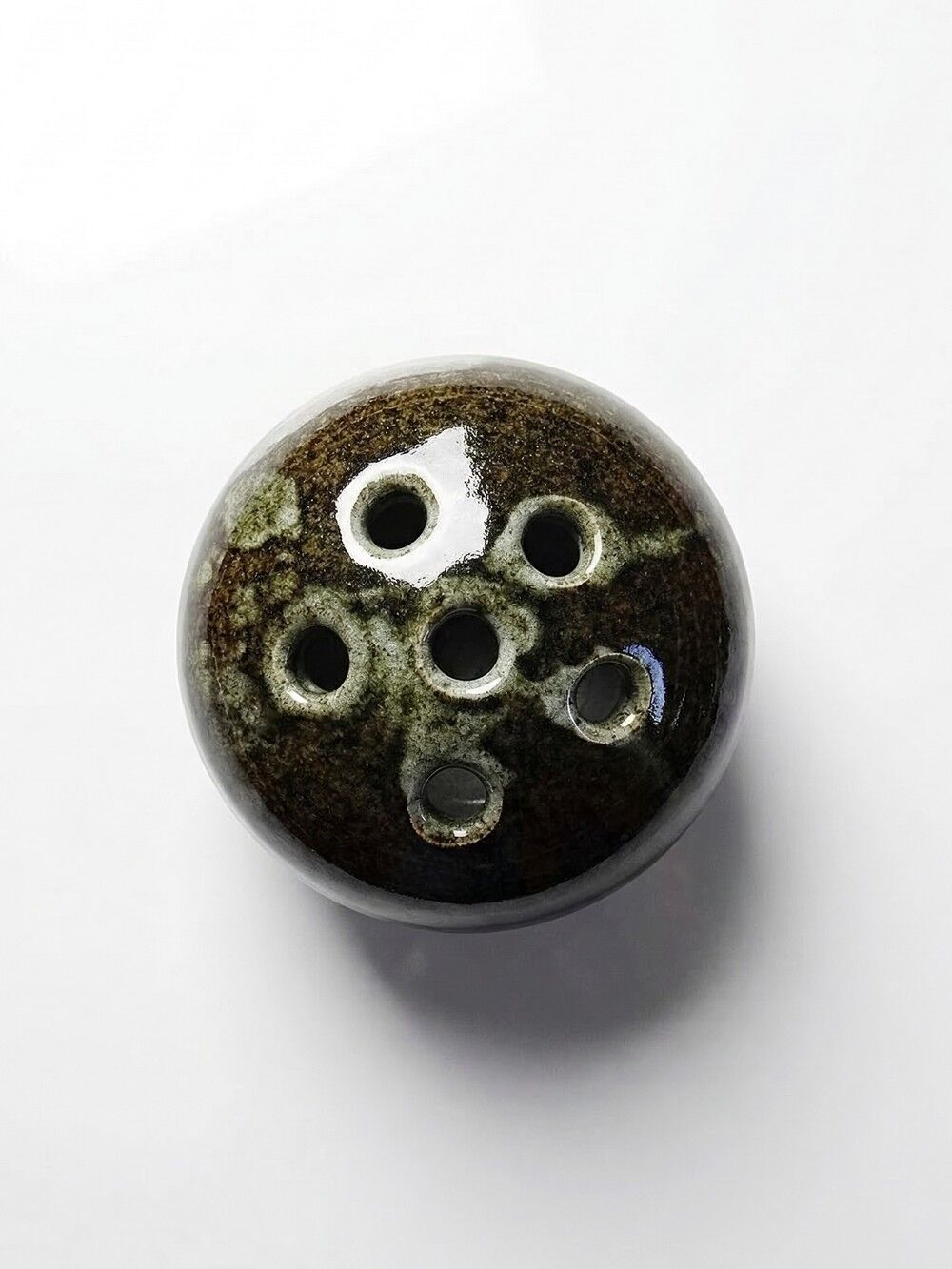 Brown and green glazed stoneware flower holder, vintage craftsmanship from the 1970s-1980s.