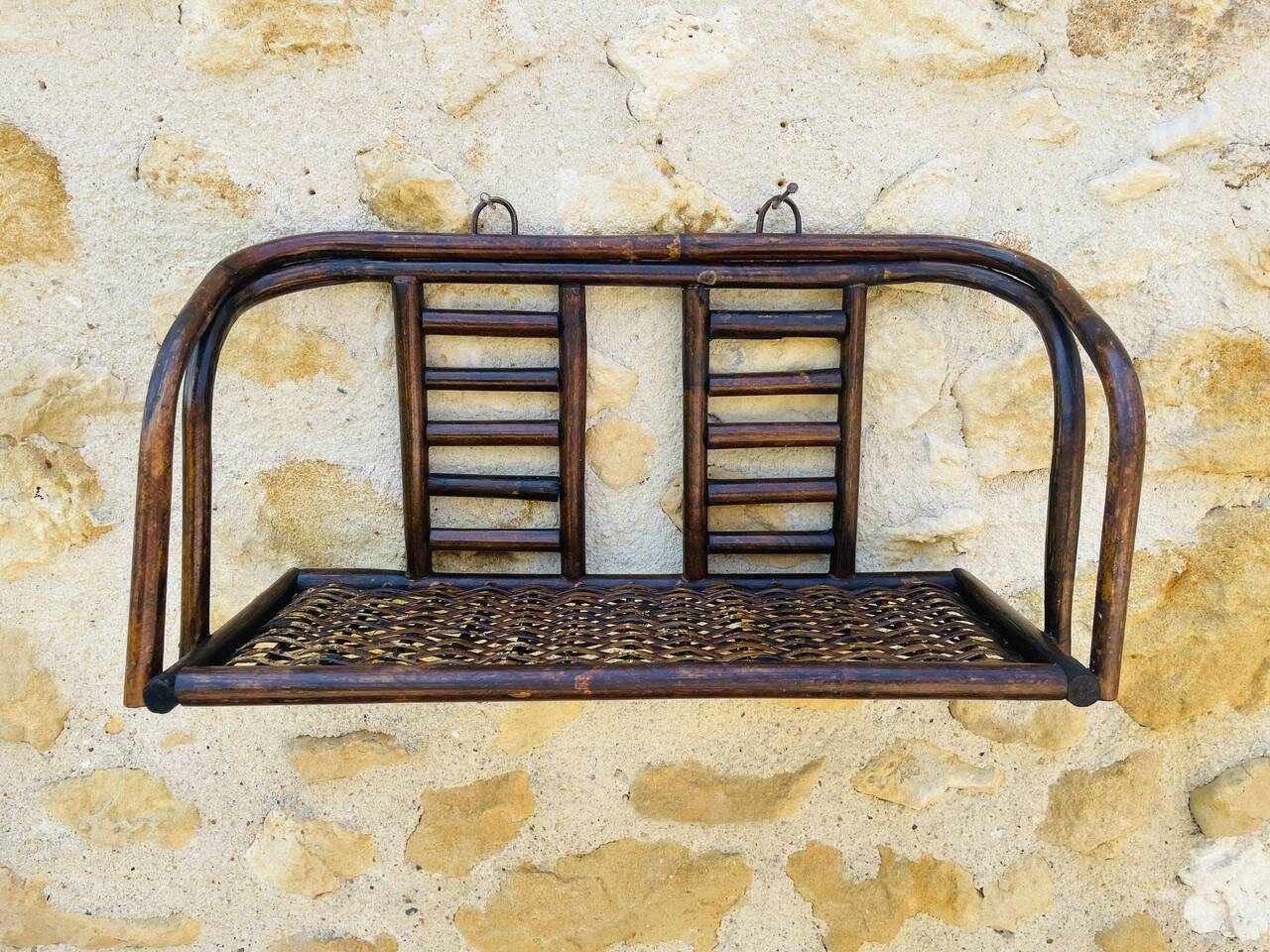 Vintage wall shelf in bamboo and rattan, circa 1960s.