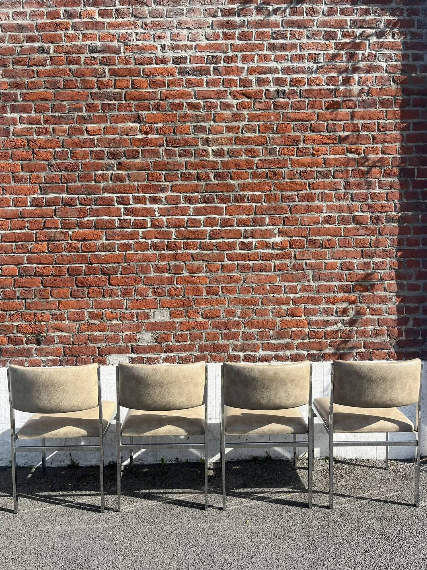 Set of 4 vintage chairs in chrome and faux leather.