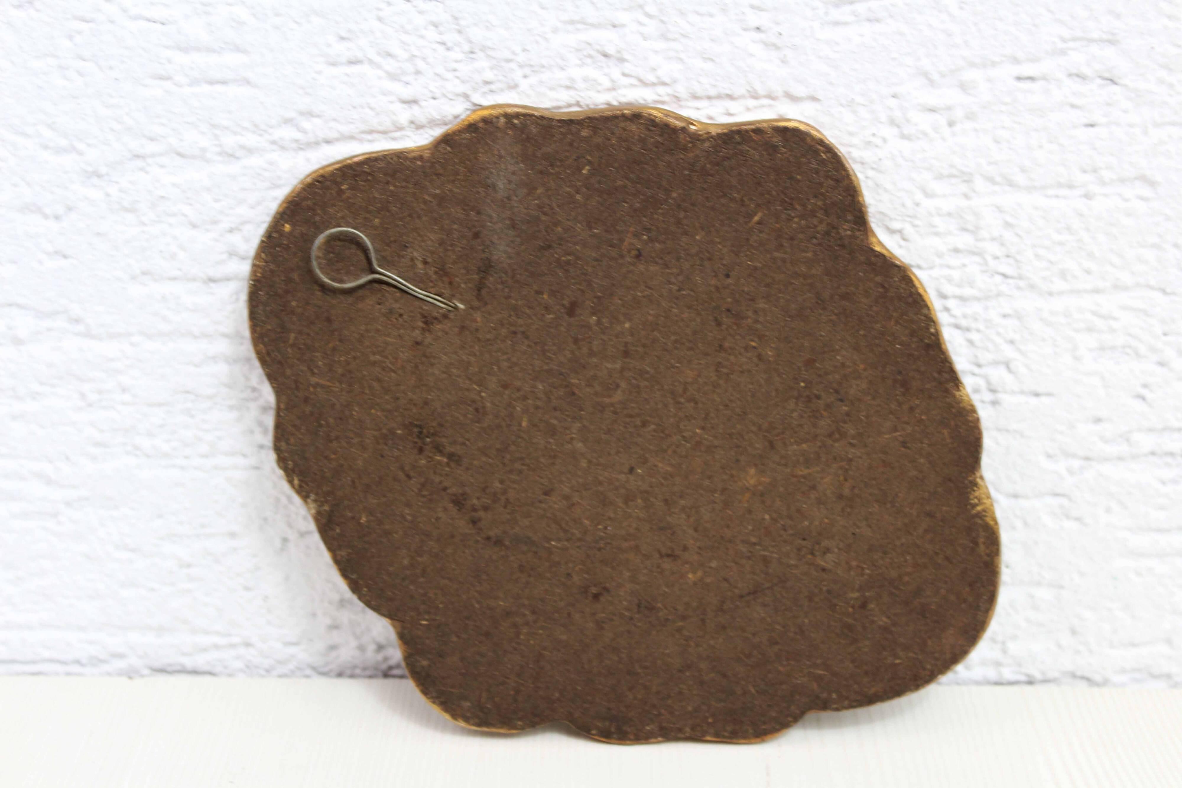 Golden mirror with decor