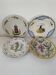 4 hand-painted earthenware plates