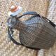 Bouteille osier bouchon porcelaine