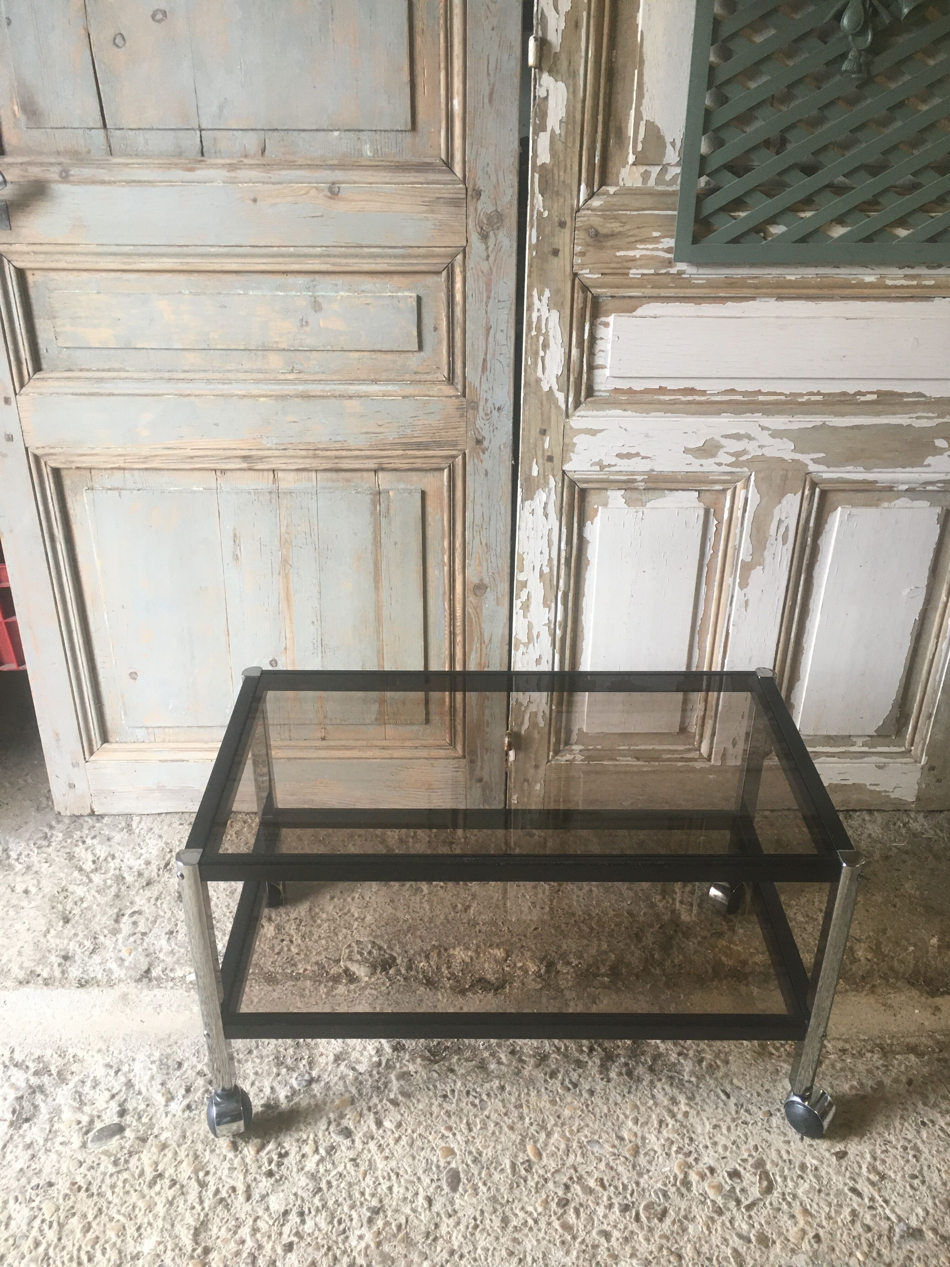 Metal coffee table with smoked glass.