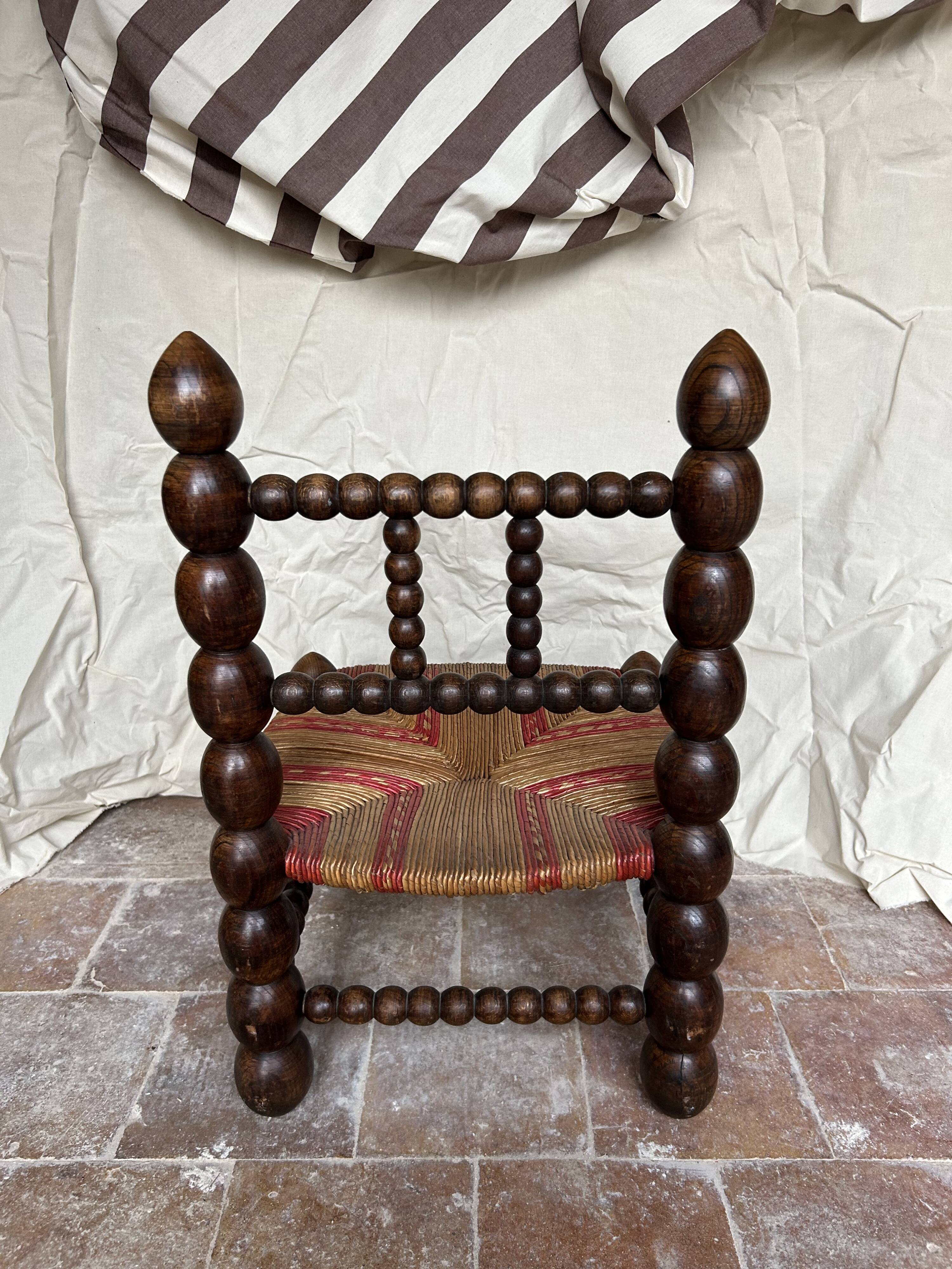 Turned wooden chair by Charles Dudouyt