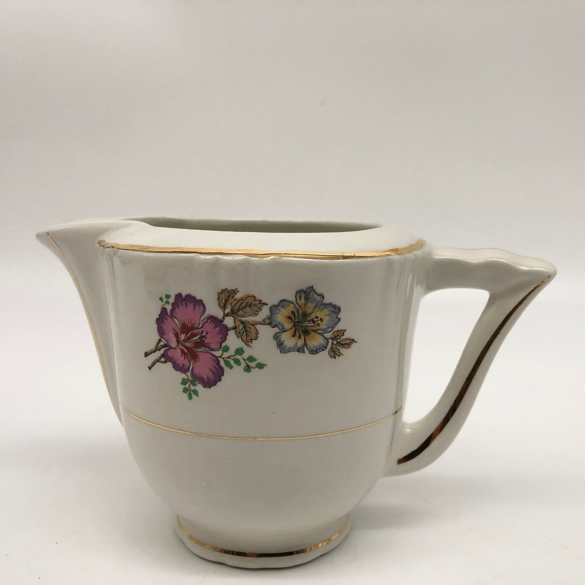 Coffee service 6 cups with saucers, sugar bowl and creamer.