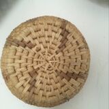 Wall composition of 9 wicker baskets and trays.