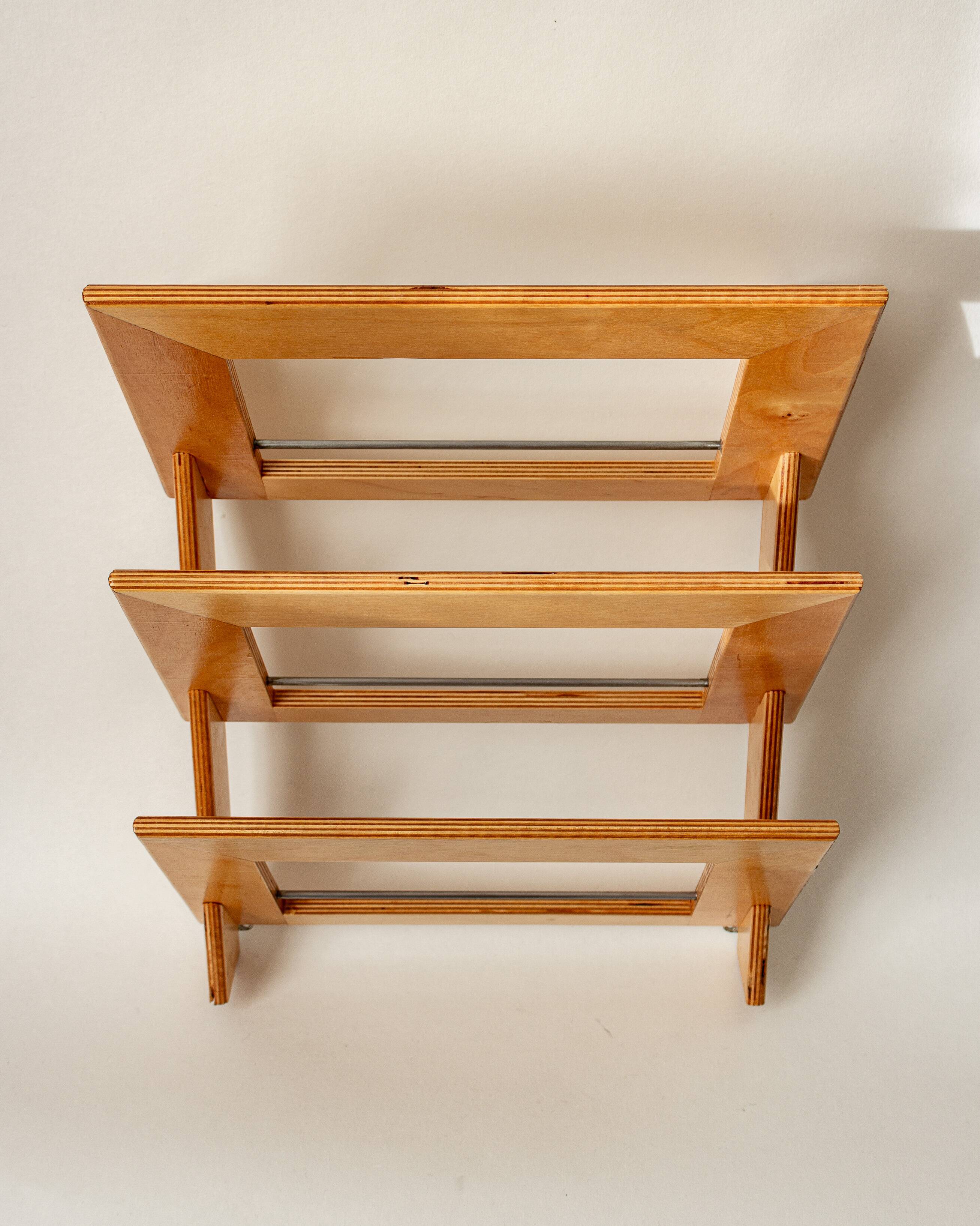Wall-mounted magazine rack in varnished plywood, 80s/90s