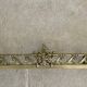 19th-century brass fireplace threshold bar