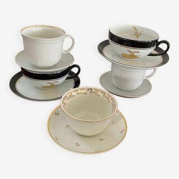 5 coffee cups in white, gold and black