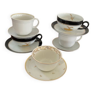 5 coffee cups in white, gold and black