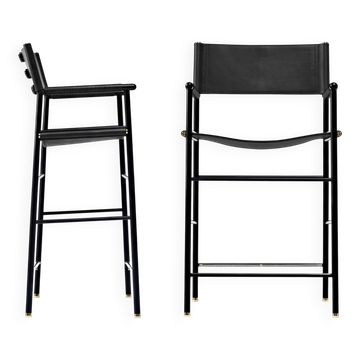 Pair of contemporary bar stools with black leather backrest and metal.