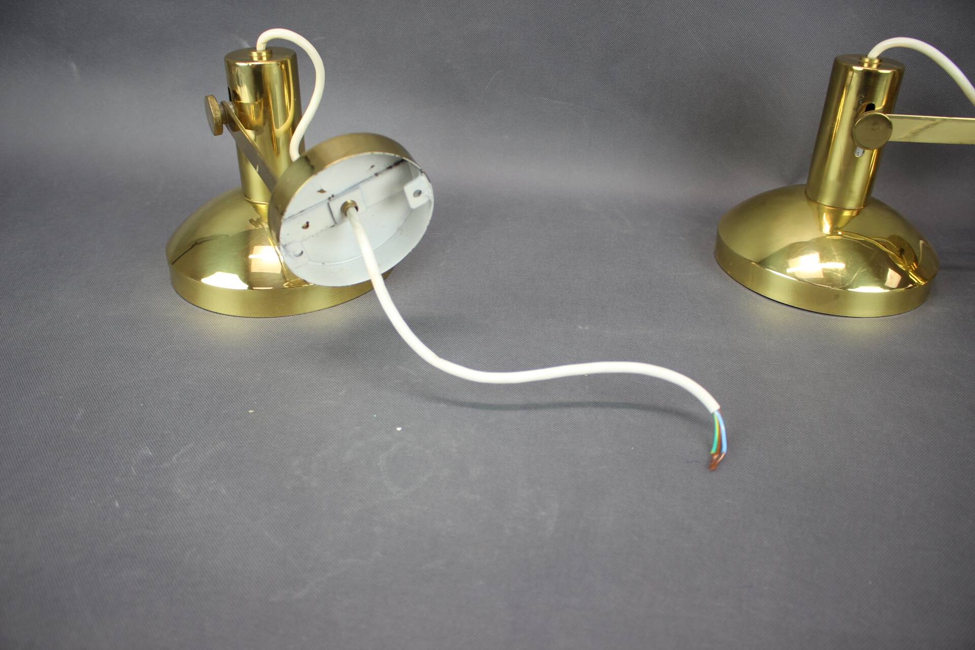 Set of four adjustable brass wall lights, Germany, 1960s.