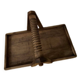 Tray with worked wooden handle.