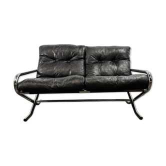 Vintage black leather two-seater patchwork sofa with chrome.