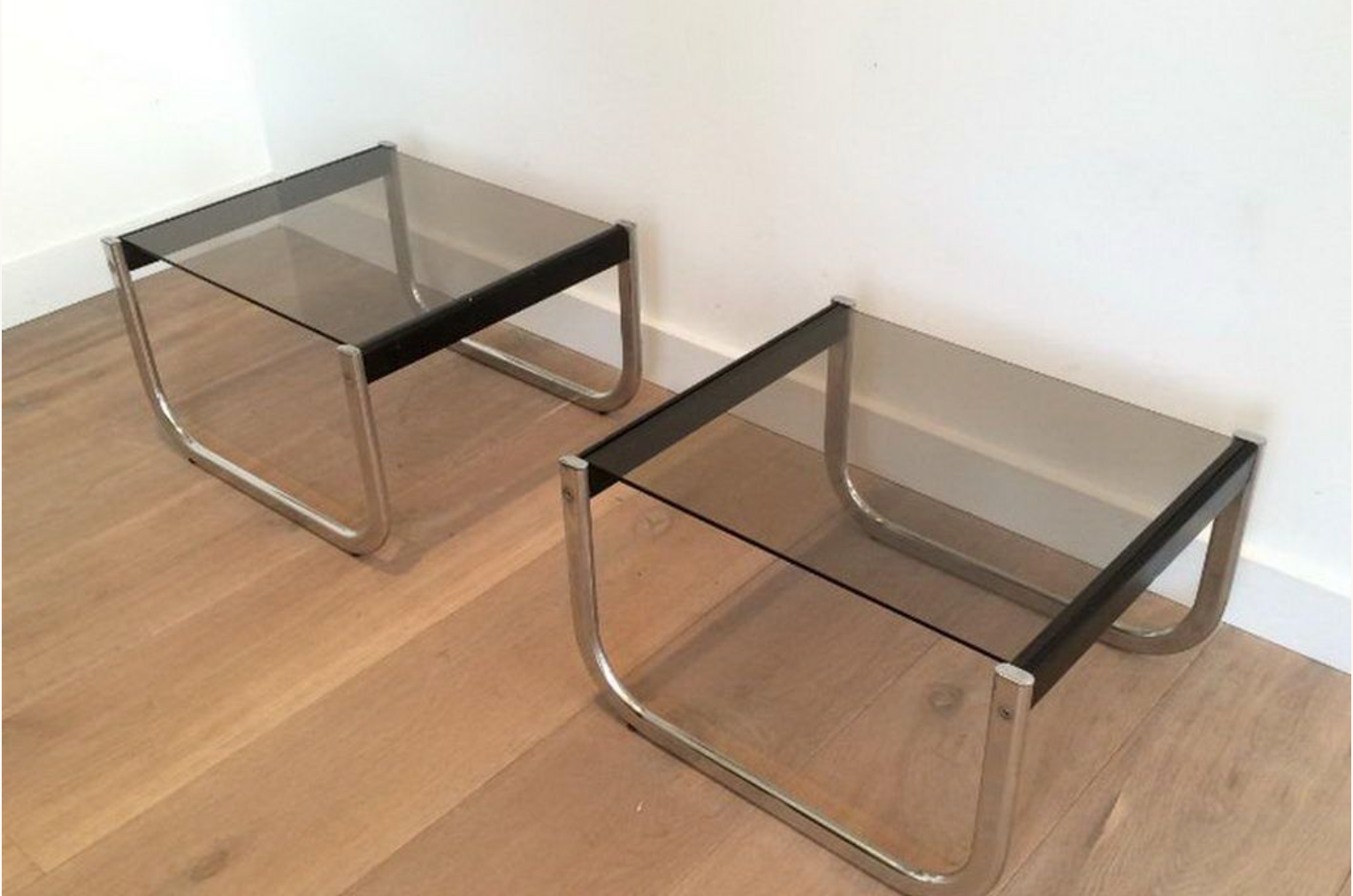 Pair of sofa ends in chrome, blackened wood and glass