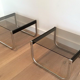 Pair of sofa ends in chrome, blackened wood and glass