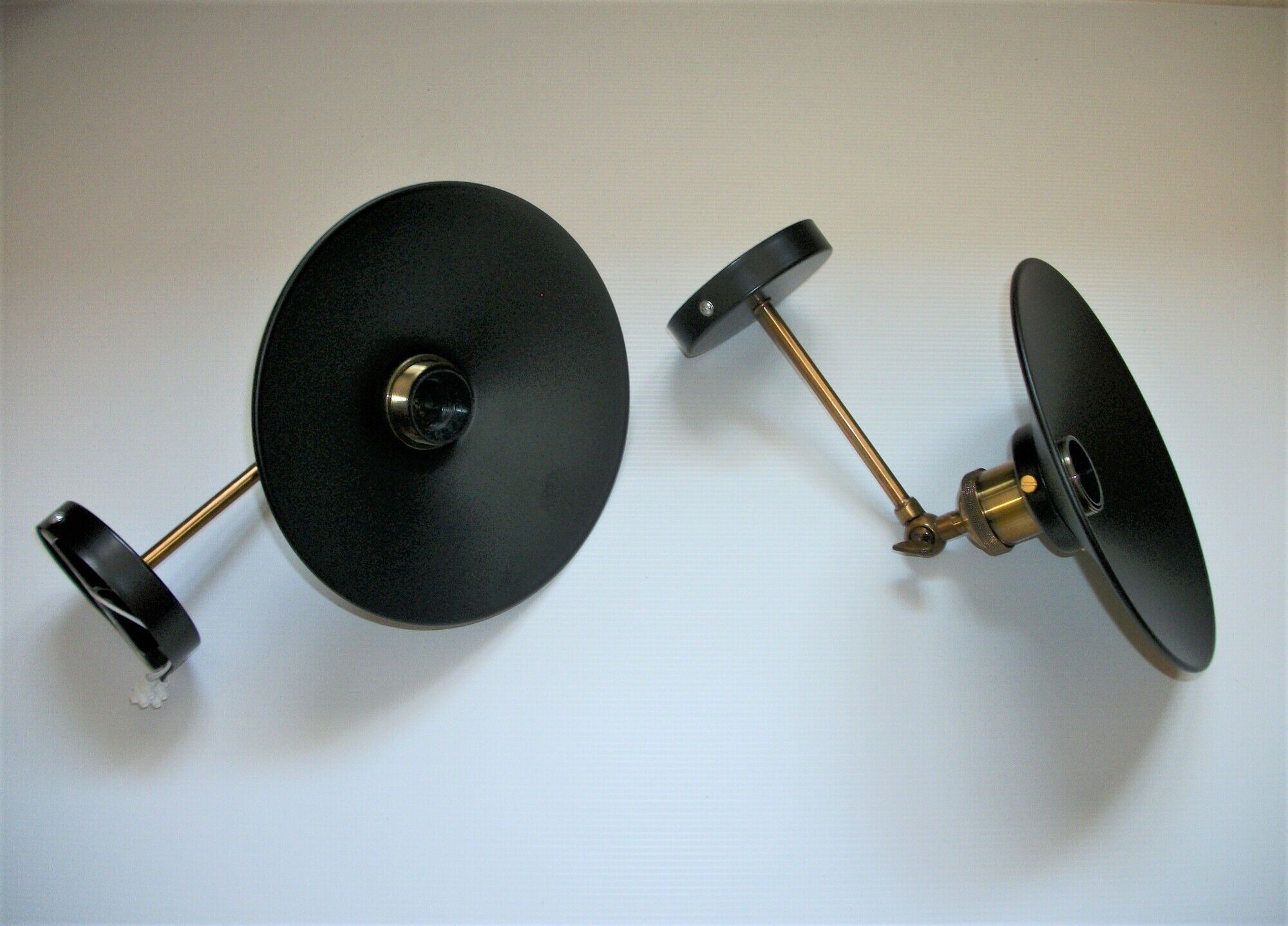 Pair of metal wall lamps in black and gold