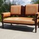 Old bench in wood and orange velvet