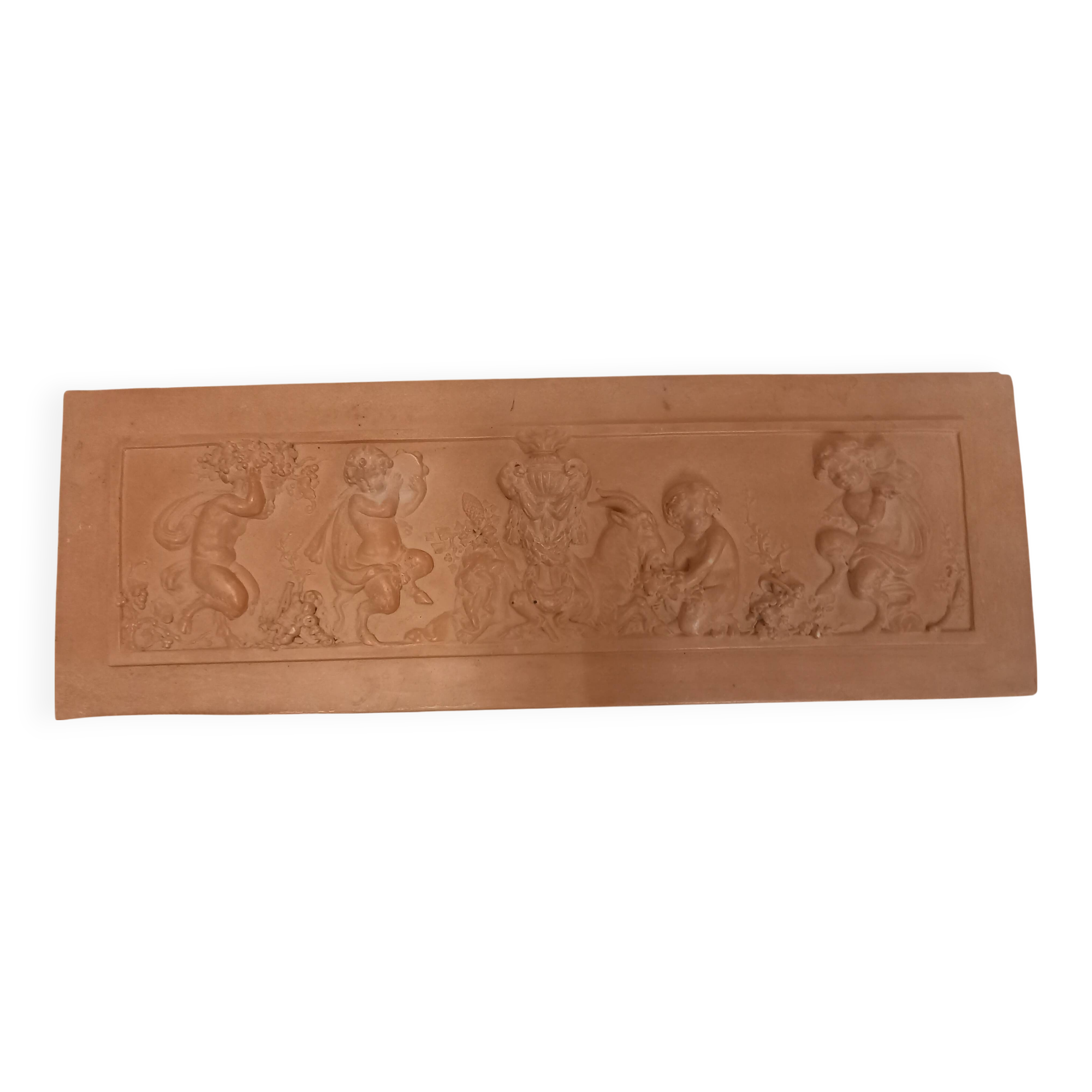 Bas relief, over door, terracotta, children and fauns harvesting grapes